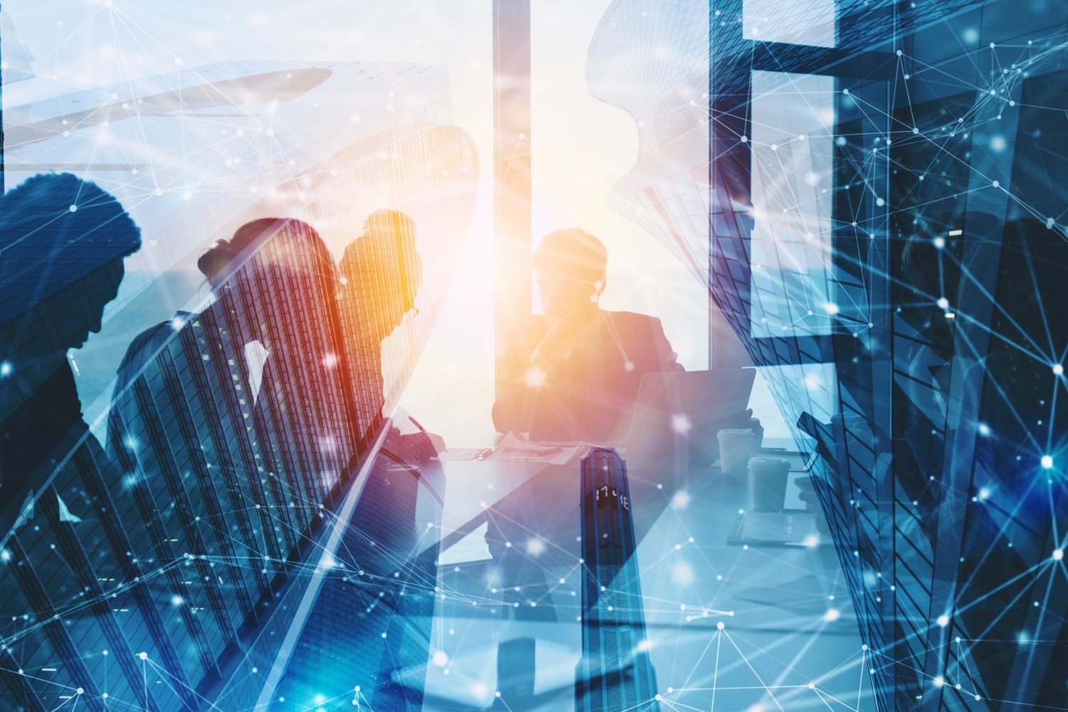 Office silhouettes against modern buildings with a network of data connections