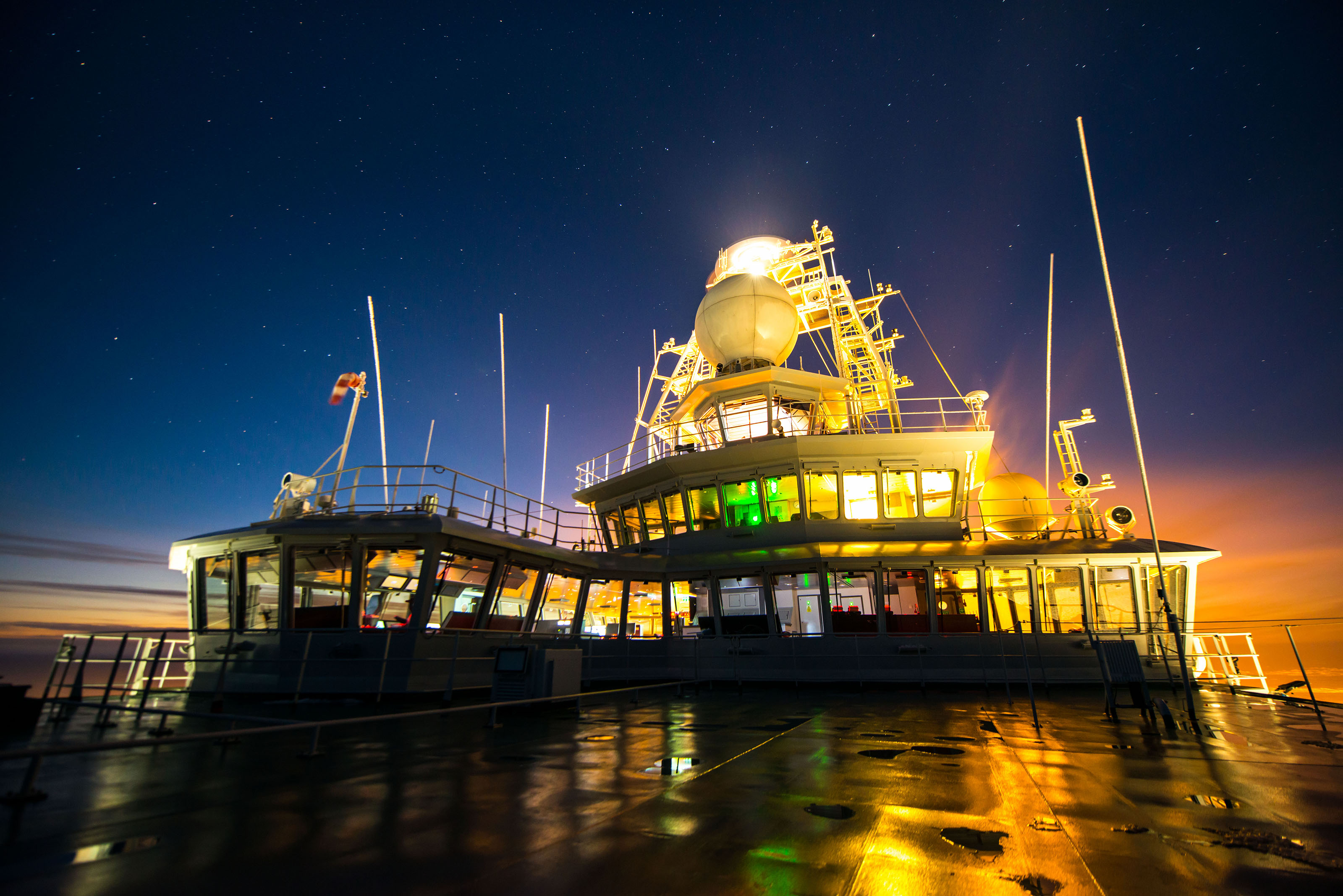 A view of the superstructure seen from the deck at night.