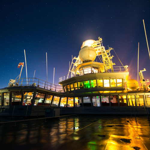 A view of the superstructure seen from the deck at night.