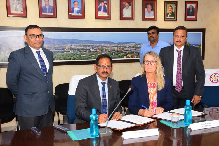 A photo of the signing ceremony between officials of Kongsberg Maritime and Hindustan Shipyard Limited