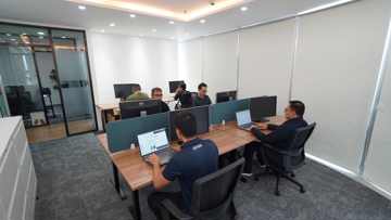 Employees working at computers in the new Kongsberg Maritime office in Manila.