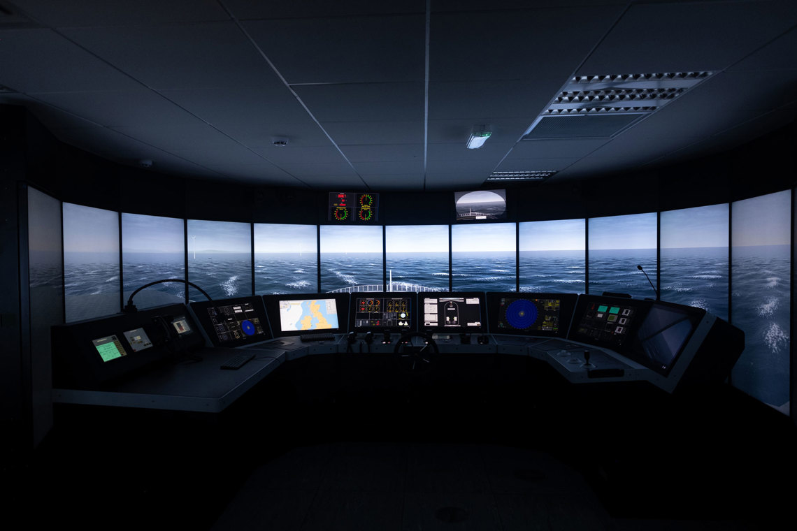Class B bridge simulator at the National Maritime College of Ireland (NMCI), providing students with realistic navigation and operational training in a classroom-based simulation environment.