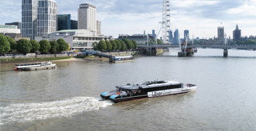 Uber boat sailing on the river Thames