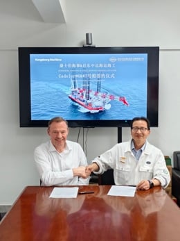 Representatives from Kongsberg Maritime and COSCO Shipping Offshore during a vessel signing ceremony for Cadeler newbuild projects.
