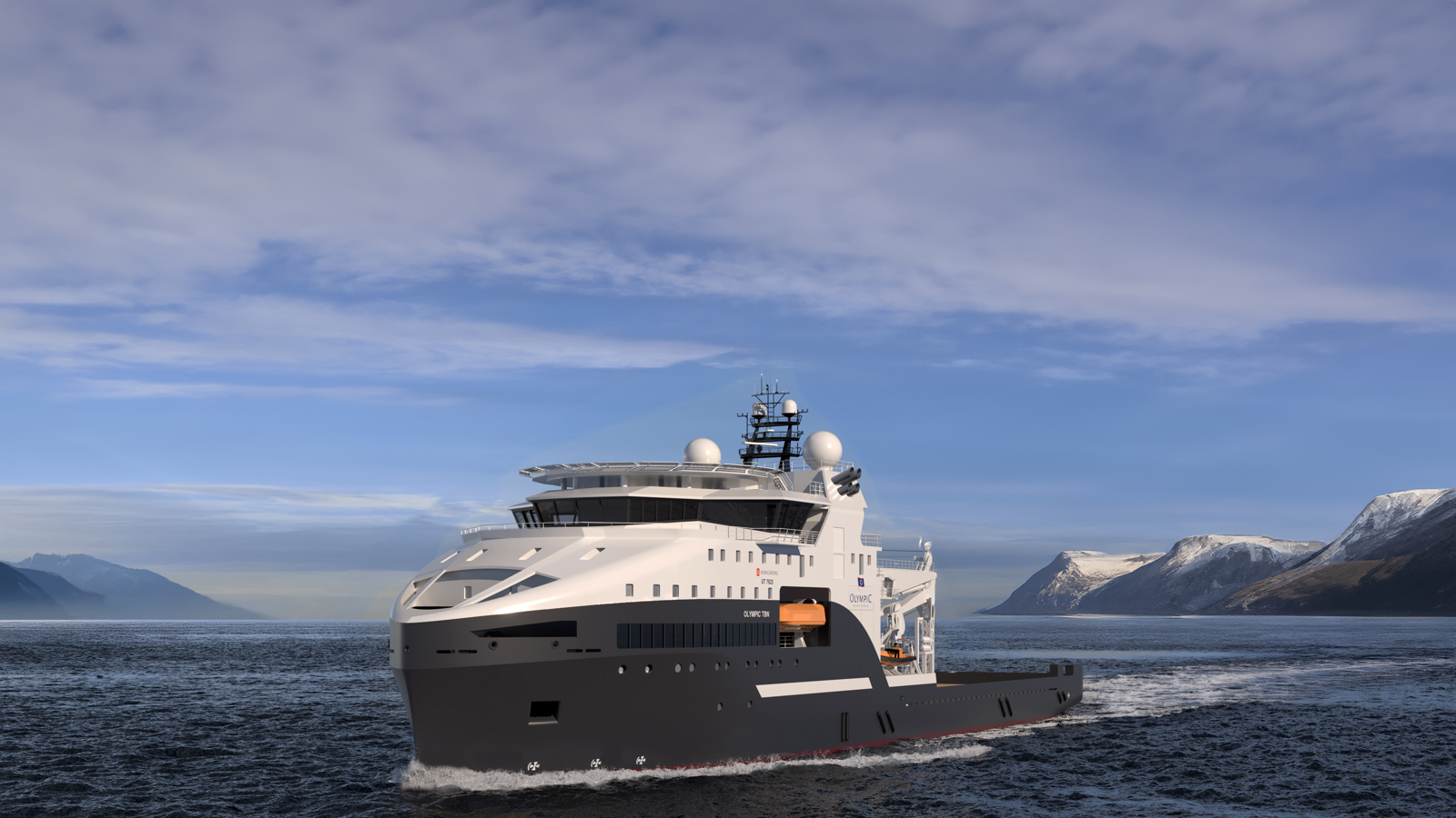 Offshore utility vessel sailing at sea with mountainous coastline in the background under a cloudy sky.