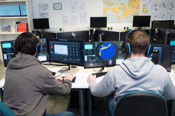 Students training on the GMDSS simulator at NMCI, practising communication and safety procedures in a realistic learning environment.