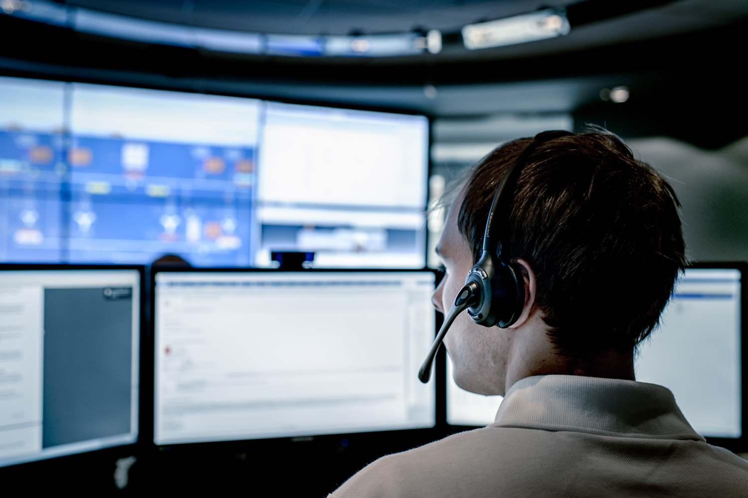 Customer support employee at a call centre receiving requests for assistance