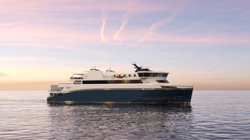 Kongsberg Maritime NVC 2080 RoPax ship design with dark blue hull and golden details at sea