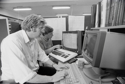 Photo of Nils Albert Jenssen working on a computer in the 70s