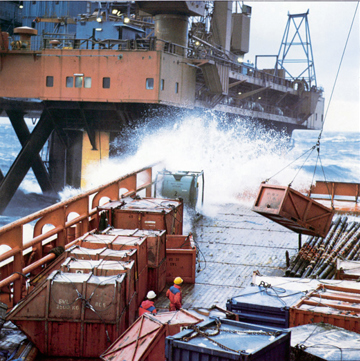 Supply ship working by offshore platform